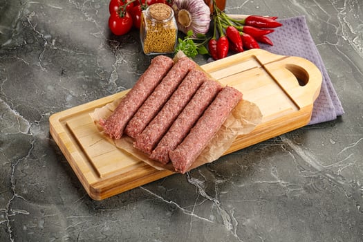 Raw beef kebab sausage for grill photo