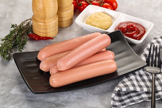 Boiled sausages with ketchup and mustard photo