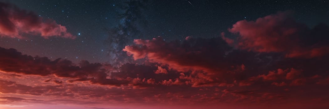 A red sky with clouds and stars over the ocean photo