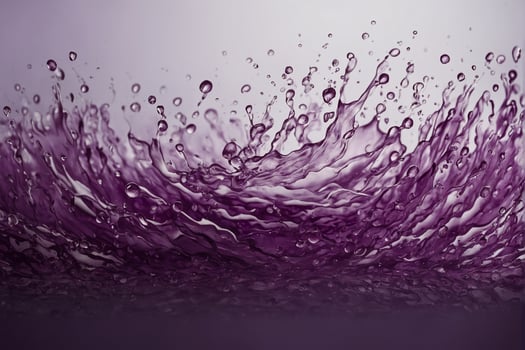 Purple liquid splash on a white background photo