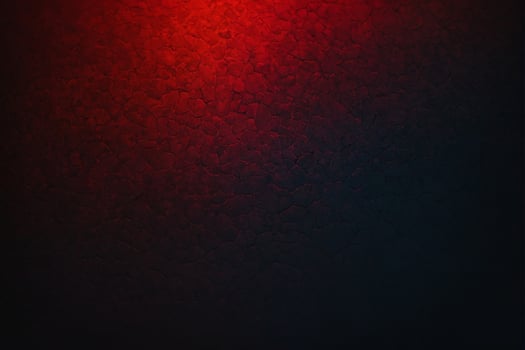 Red and black background with a red light photo