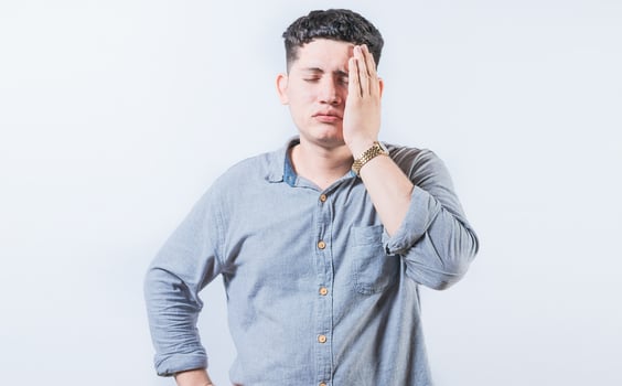 Exhausted person putting the palm of his hand on his face. Tired and exhausted man covering his face with the palm hand photo