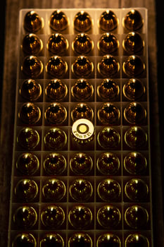 Pistol cartridges 9 mm. Ammunition for pistols and PCC carbines on a dark back photo