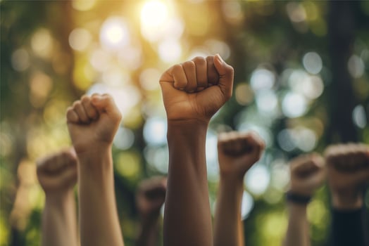 Multiethnic people are raising their fists, protesting for their rights photo
