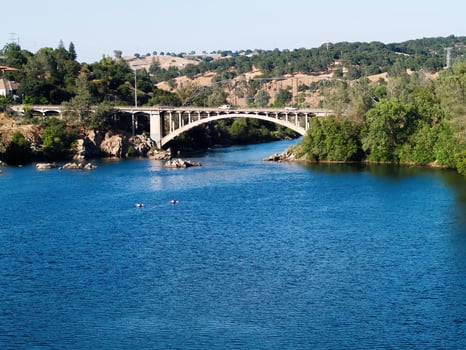 Folsom, CA, 2007 - Two Kayaks On Water Heading For Bridge photo