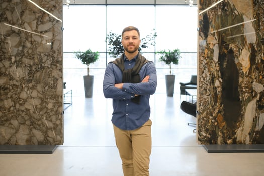 Man chooses wall tiles for the bathroom in the supermarket building materials photo
