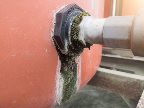 The outlet pipe line in the water reservoir is mossy due to a water leak. photo