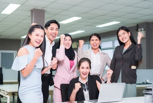 Successful team of young perspective business people in the office, Success business group celebrating after meeting photo