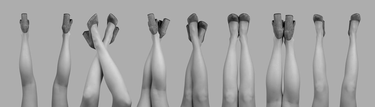 Women legs up, wearing heeled shoes set photo