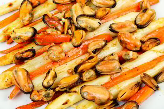 Roasted mussels with asparagus, salad,close up. photo
