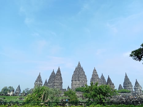 Prambanan temple with bright blue clouds photo