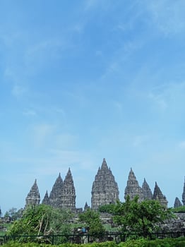 Prambanan temple with bright blue clouds photo