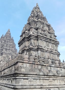 Prambanan temple with bright blue clouds photo