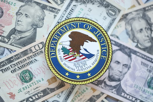 KYIV, UKRAINE - MARCH 9, 2024 US Department of Justice seal on many US dollar bills photo