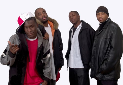 Four Black Brothers On White Background Wearing Jackets photo