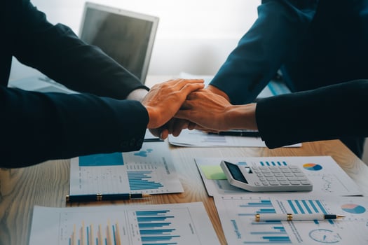 Business people join hands to join forces as a teamwork. photo