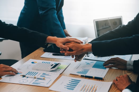 Business people join hands to join forces as a teamwork. photo