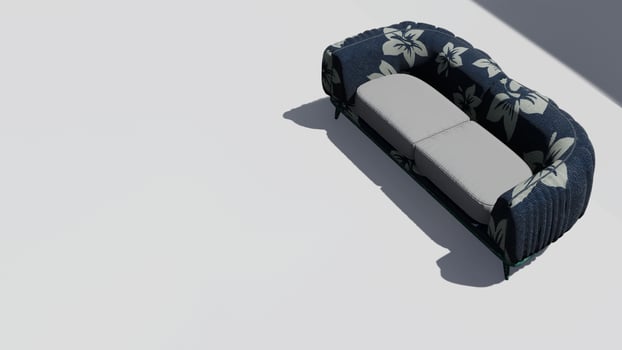 A blue and white couch with a floral pattern photo