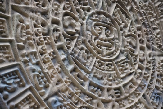 Ancient Mayan Calendar or Aztec calendar with rough relief surface photo