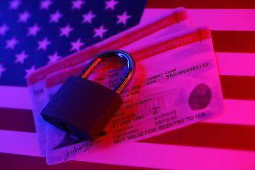 US Employment authorization card with small padlock on United States flag photo