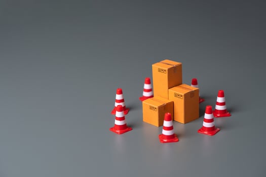 Boxes bounded by traffic cones. Cargo seizure and export restrictions. Economic impediments. Affecting economies and businesses, dependent on the uninterrupted exchange of goods photo