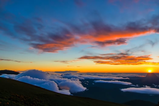 Beautiful Clouds Over the Mountains Create a Harmonious Atmosphere, Painting a Serene and Majestic Scene of Natural Beauty photo