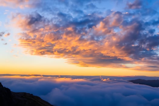 Beautiful Clouds Over the Mountains Create a Harmonious Atmosphere, Painting a Serene and Majestic Scene of Natural Beauty photo