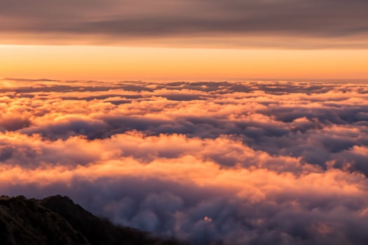 Beautiful Clouds Over the Mountains Create a Harmonious Atmosphere, Painting a Serene and Majestic Scene of Natural Beauty photo