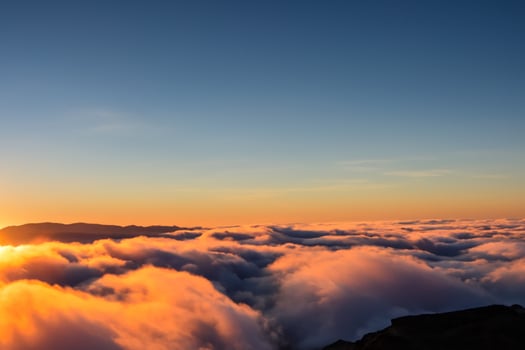 Beautiful Clouds Over the Mountains Create a Harmonious Atmosphere, Painting a Serene and Majestic Scene of Natural Beauty photo