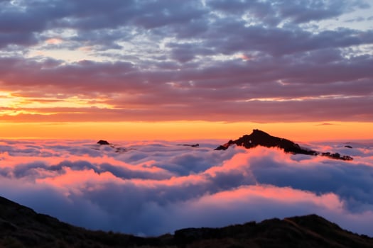 Majestic Sunrise Beautiful Clouds Over the Mountains Create a Harmonious Atmosphere, Painting a Serene and Majestic Scene of Natural Beauty photo