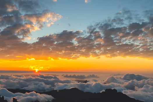 Majestic Sunrise Beautiful Clouds Over the Mountains Create a Harmonious Atmosphere, Painting a Serene and Majestic Scene of Natural Beauty photo