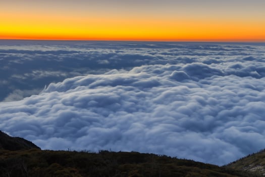Majestic Sunrise Beautiful Clouds Over the Mountains Create a Harmonious Atmosphere, Painting a Serene and Majestic Scene of Natural Beauty photo