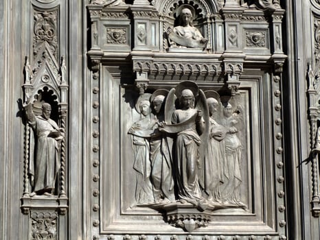 Florence Cathedral Santa Maria dei Fiori Italy - detail of sculpture of door photo