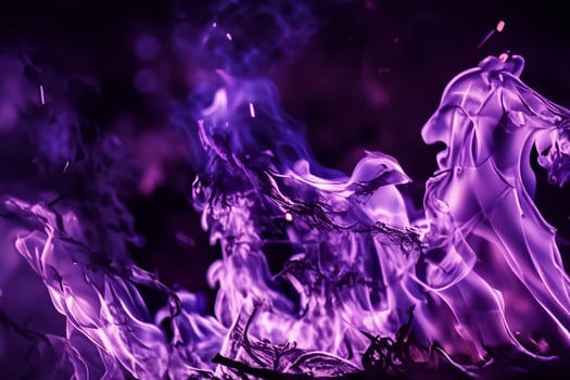 The Mesmerizing Purple Flames Dance Gracefully Against the Pitchblack Backdrop, Creating an Enchanting and Captivating Scene photo