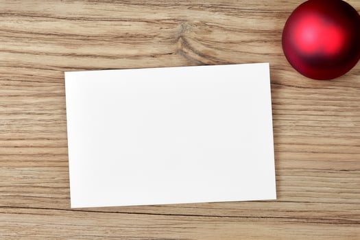 Beautiful Mockup White Card with Christmas Ornaments, A Festive Touch for Your Holiday Greetings photo