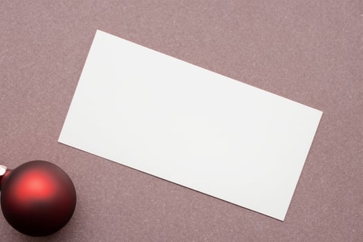 Beautiful Mockup White Card with Christmas Ornaments, A Festive Touch for Your Holiday Greetings photo