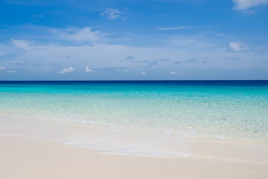 Beautiful Waves and Sands A Mesmerizing Display of Nature's Harmony, Where Crystal Clear Waters Meet Soft Golden Sands, Creating a Serene and Captivating Seascape That Enchants the Soul photo