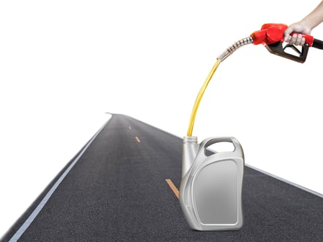 Holding a gasoline injector into a gallon with a road background photo