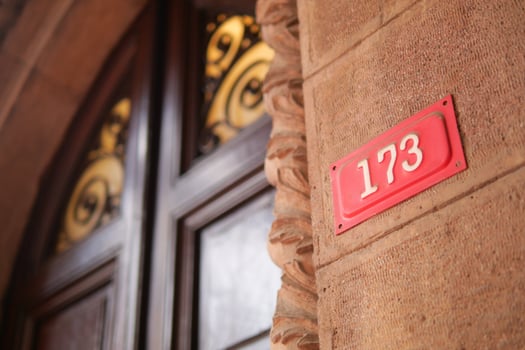 house number. Decorative lettering on a brick wall. photo