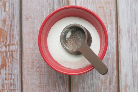 Coarse salt in a bowl on table photo