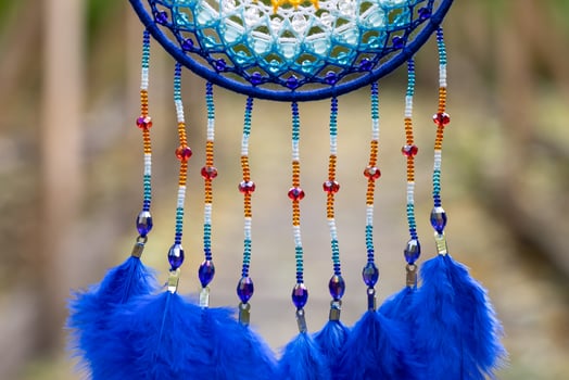 Handmade dream catcher with feathers threads and beads rope hanging photo