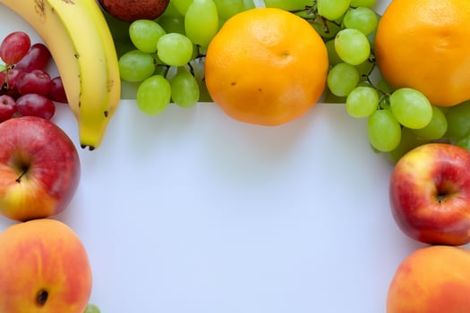 Card and White Paper Mockup Harmonized with Fresh Fruit, Crafting a Visual Symphony of Artful Design and Culinary Delight, Where Wholesome Ingredients Merge in a Feast of Vibrant Imagery photo