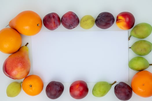 Card and White Paper Mockup Harmonized with Fresh Fruit, Crafting a Visual Symphony of Artful Design and Culinary Delight, Where Wholesome Ingredients Merge in a Feast of Vibrant Imagery photo