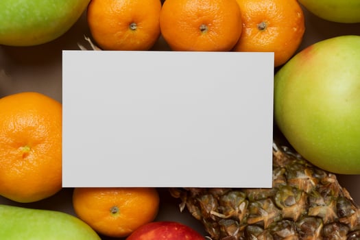 Card and White Paper Mockup Harmonized with Fresh Fruit, Crafting a Visual Symphony of Artful Design and Culinary Delight, Where Wholesome Ingredients Merge in a Feast of Vibrant Imagery photo