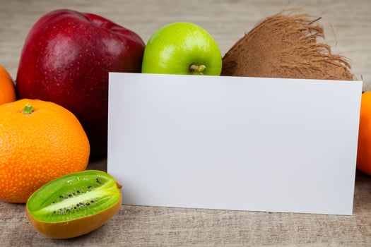 Card and White Paper Mockup Harmonized with Fresh Fruit, Crafting a Visual Symphony of Artful Design and Culinary Delight, Where Wholesome Ingredients Merge in a Feast of Vibrant Imagery photo