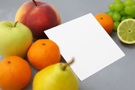 Card and White Paper Mockup Harmonized with Fresh Fruit, Crafting a Visual Symphony of Artful Design and Culinary Delight, Where Wholesome Ingredients Merge in a Feast of Vibrant Imagery photo