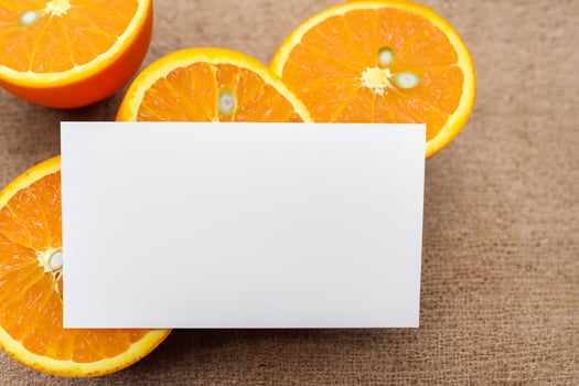 Generated imageWhite Paper Mockup Enlivened by the Zesty Aura of Fresh Oranges, Crafting a Visual Symphony of Culinary Opulence and Wholesome Design photo