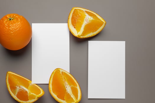 Generated imageWhite Paper Mockup Enlivened by the Zesty Aura of Fresh Oranges, Crafting a Visual Symphony of Culinary Opulence and Wholesome Design photo