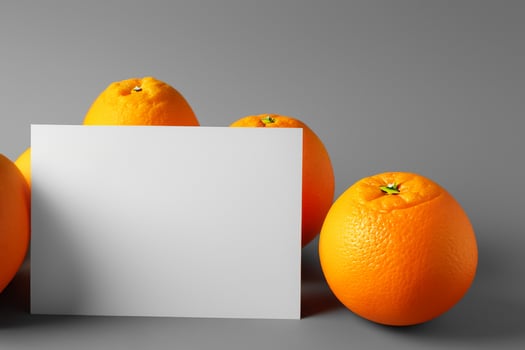 White Paper Mockup Enlivened by the Zesty Aura of Fresh Oranges, Crafting a Visual Symphony of Culinary Opulence and Wholesome Design photo