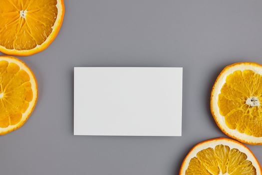 White Paper Mockup Enlivened by the Zesty Aura of Fresh Oranges, Crafting a Visual Symphony of Culinary Opulence and Wholesome Design photo